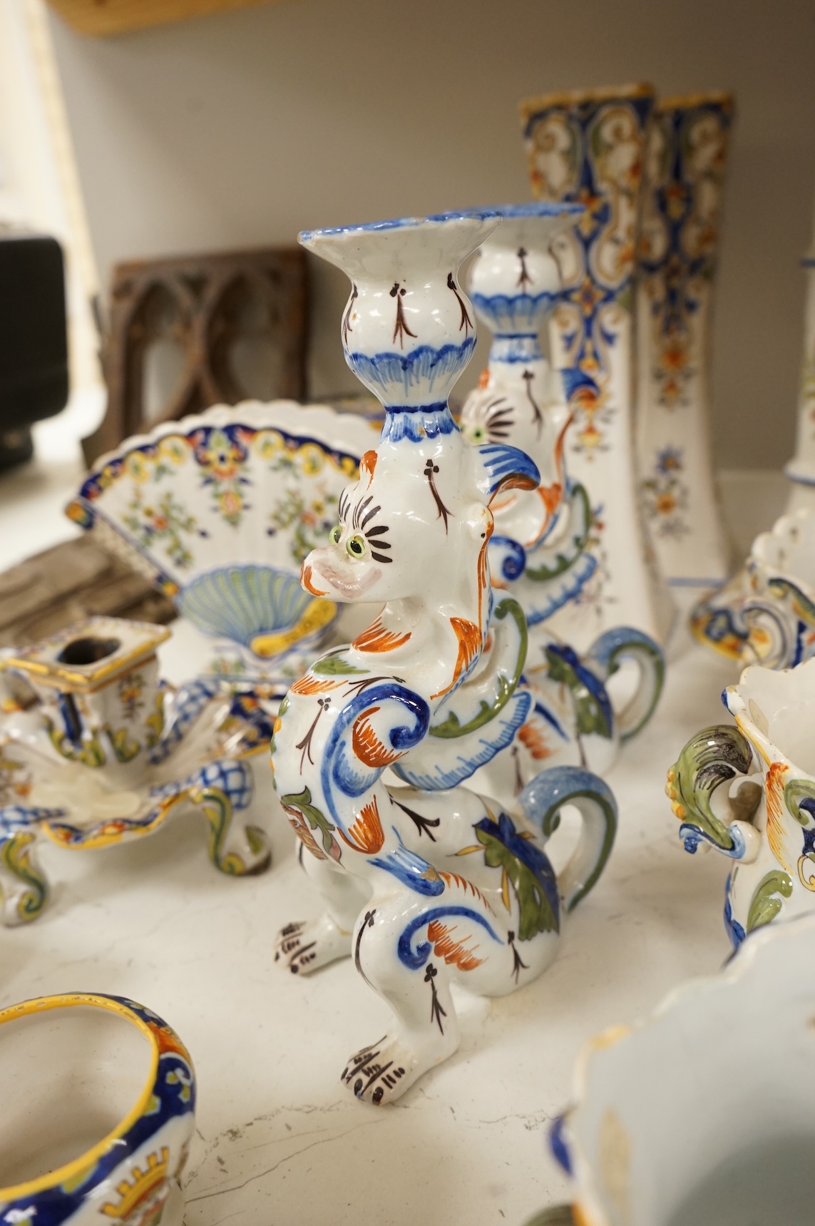 A collection of early 20th century French faience pieces, tallest 37cm